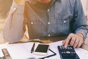 Man deciding whether to consolidate his debt