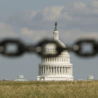 U.S. Capitol with a chain link in front of it