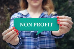 Woman holding nonprofit sign