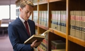 Handsome lawyer in the law library at the university